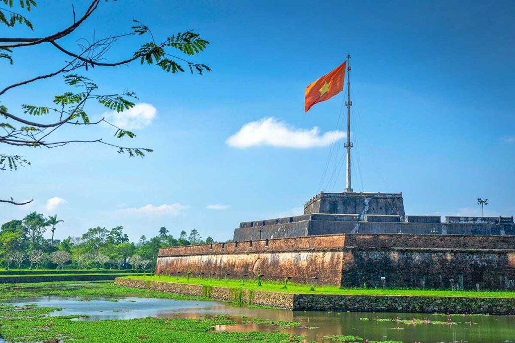 The Hue Flag Tower and moat on a clear sunny day