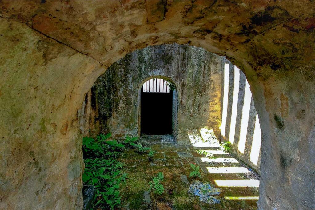 An animal cage as part of the whole stone structure of Hue's tiger arena
