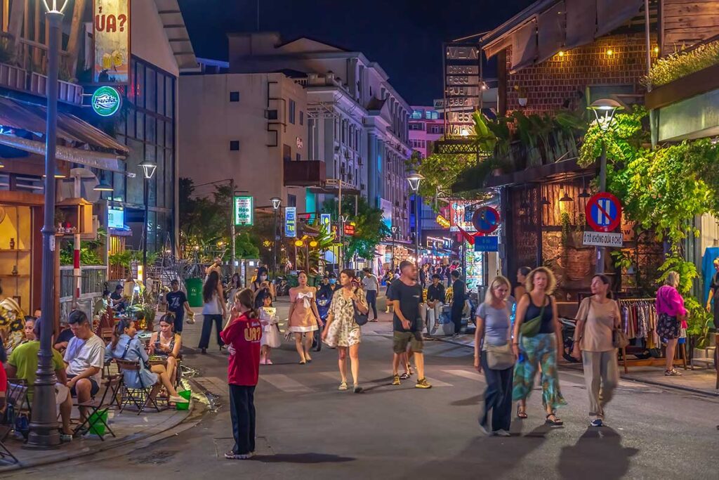Locals and tourists mixing on the streets of Hue Walking Street in the weekend at night
