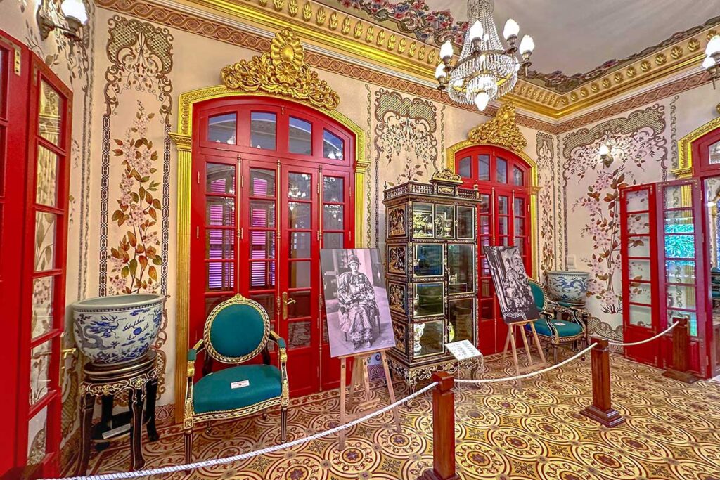 Antiques furniture and ceramic pots inside a beautiful room of Kien Trung Palace within Hue Imperial City