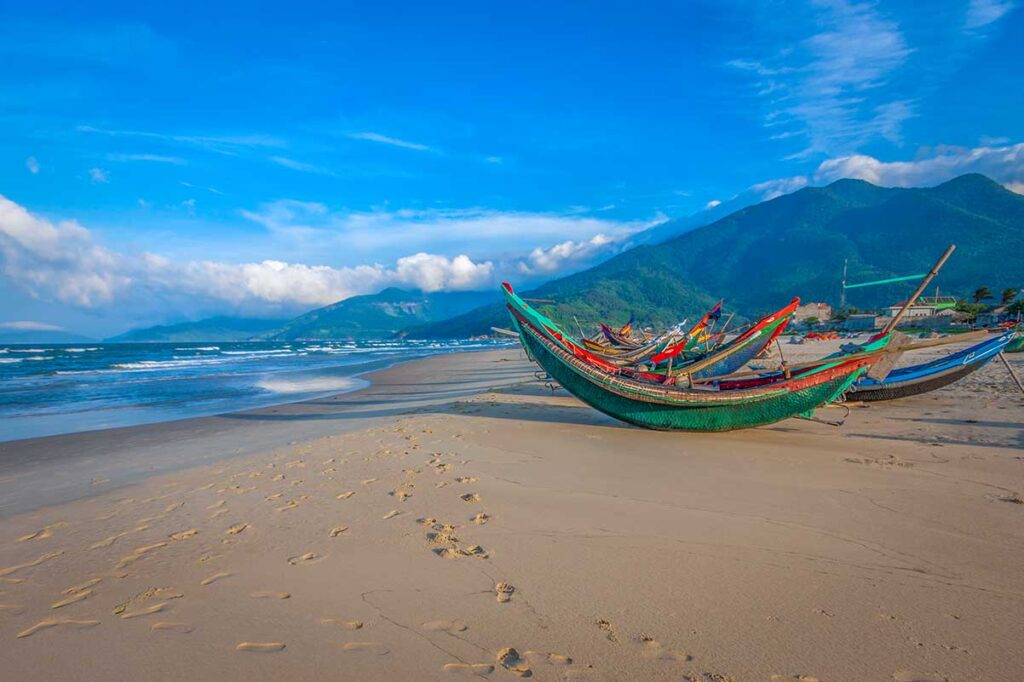 Small local wooden fishing boats on Lang Co Beach