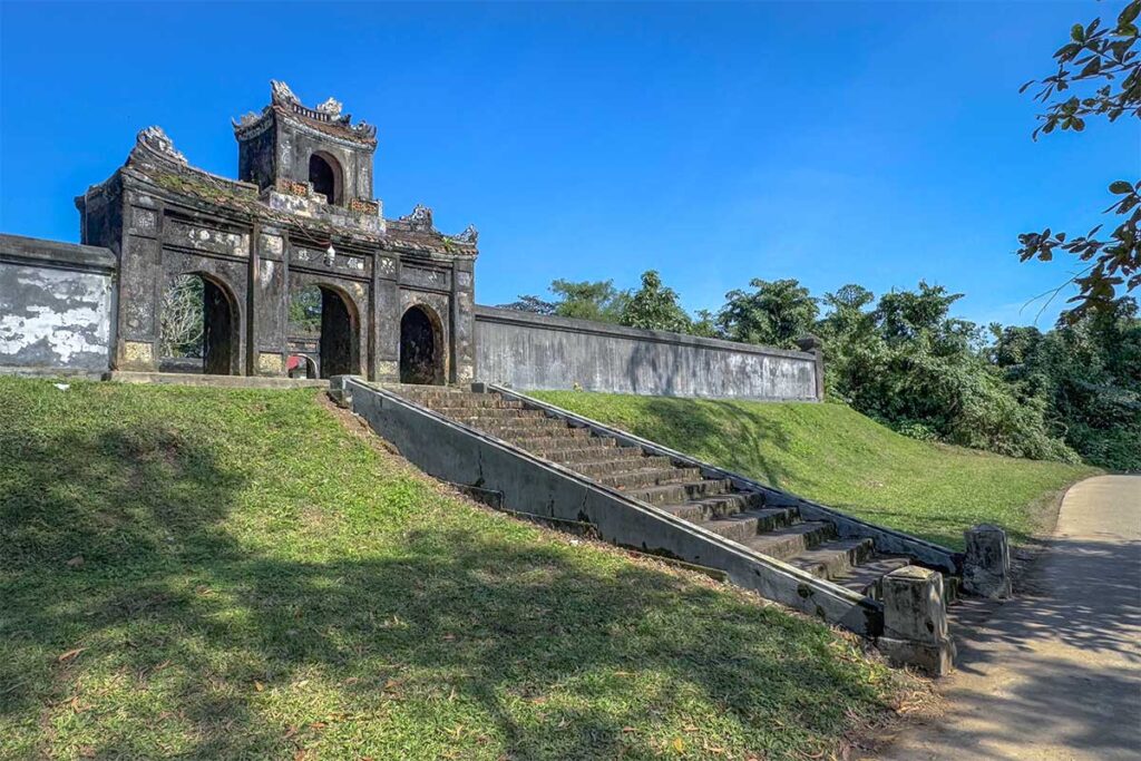 Stairs leading to the triple gate serving as the entrance to Long Chau Temple in Hue