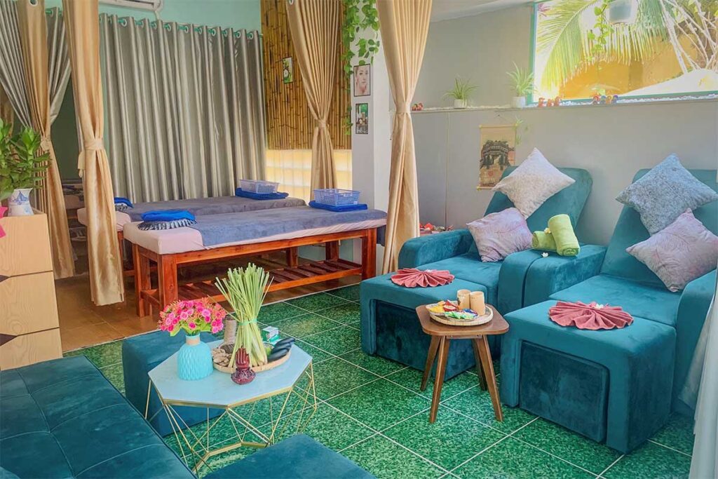 Relaxing spa interior offering massage treatments near An Bang Beach Hoi An, with cozy chairs and tropical decor.