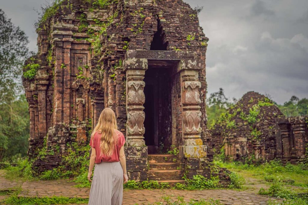 Ancient Cham ruins at My Son Temple Complex near Hoi An surrounded by jungle greenery