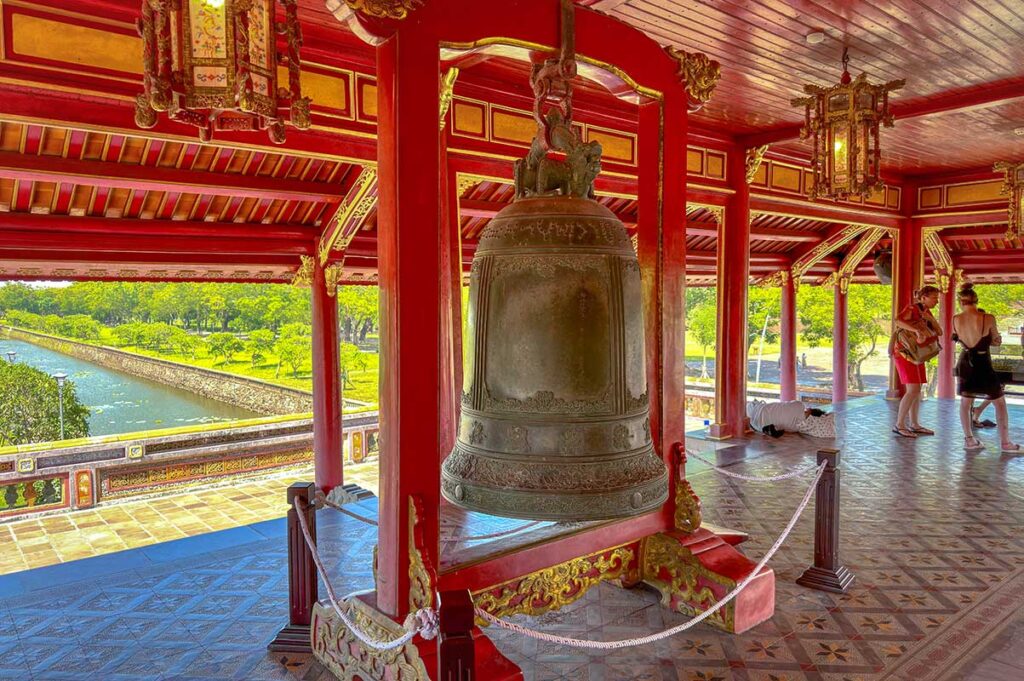 A huge bronze bell inside the Ngo Mon Gate