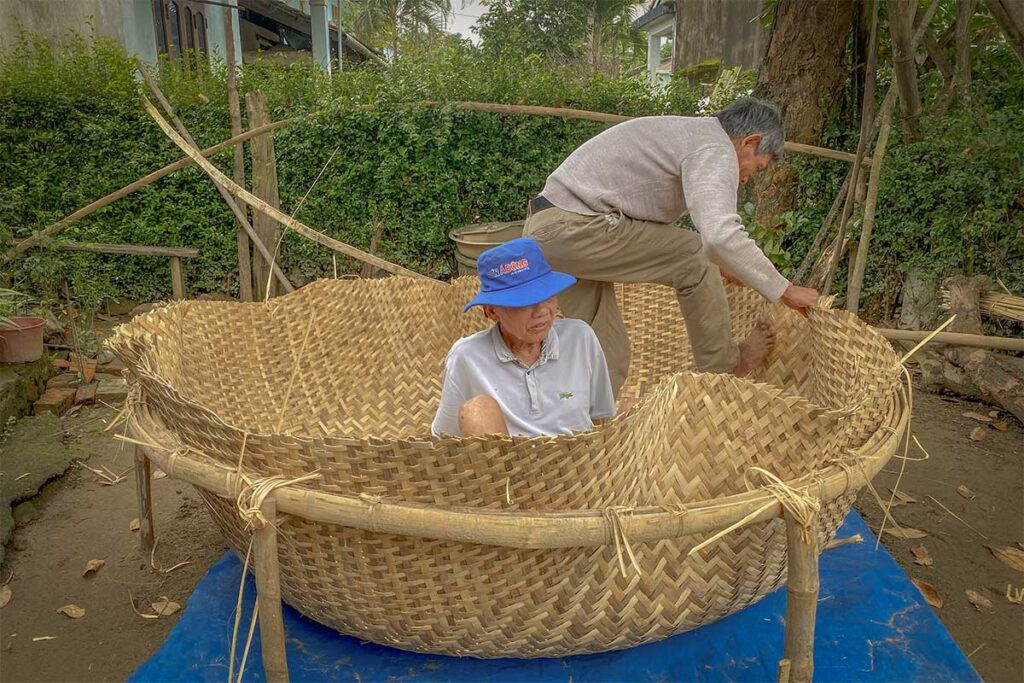 Countryside scene of Ta Nhieu Village on Cam Kim Island, with bamboo gardens and traditional farming lifestyle.