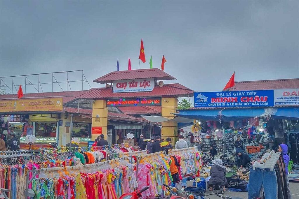Clothes stalls in front of the Tay Loc Market in Hue