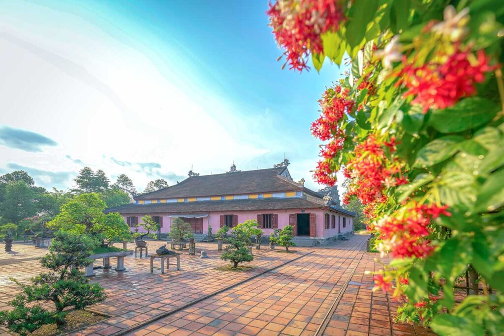 Bonsai trees in an open courtyard space of Thien My Pagoda