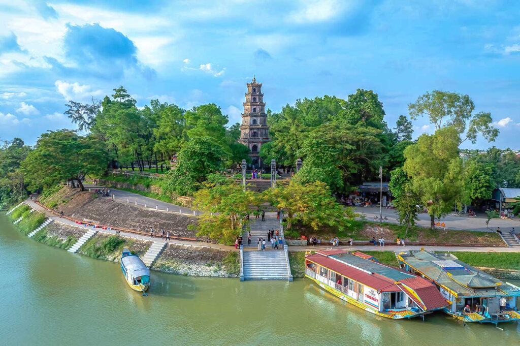 Dragon boats on the Perfume River are docked at Thien Mu Pagoda