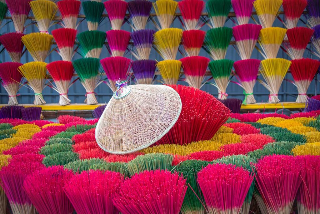 A conical hat is places on  stacks of incense at Thuy Xuan Incense village
