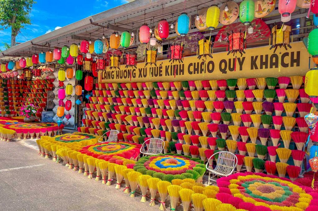 A wall of incense at a store in the street of Thuy Xuan Incense Village in Hue