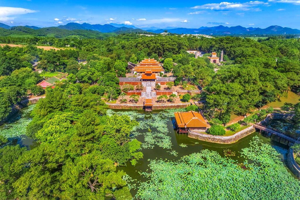 Aerial view of Tu Duc Tomb with several temple buildings and a large lake