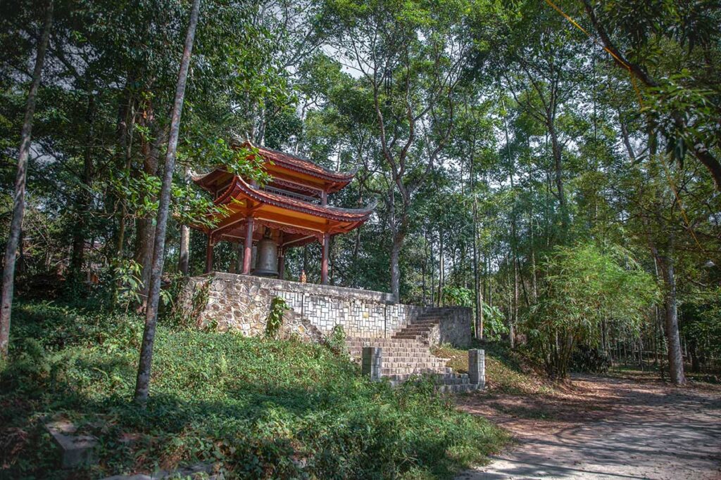 Forest path leading to the stairs up to Bell pavilion at Tu Hieu Pagoda