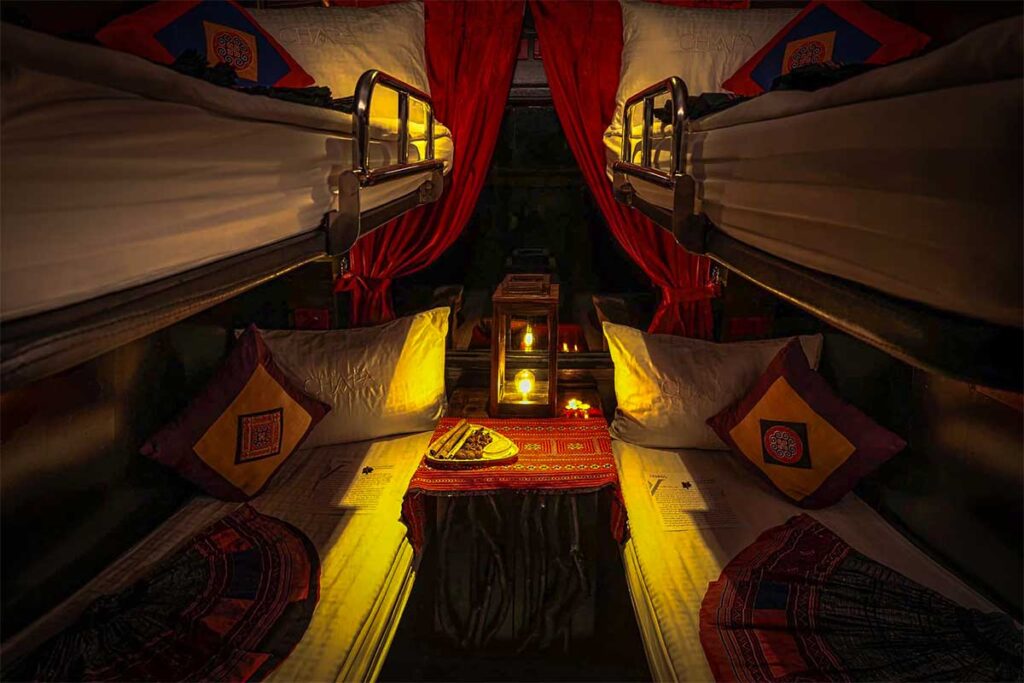 Nicely decorated 4-berth cabin with 2 bunk beds inside the tourist train of Chapa running from Hanoi to Sapa