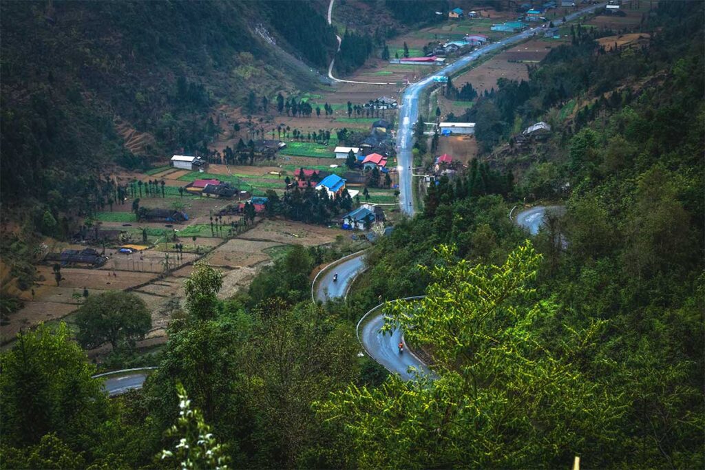 Aerial view of Chin Khoanh with roads winding up the mountain slope