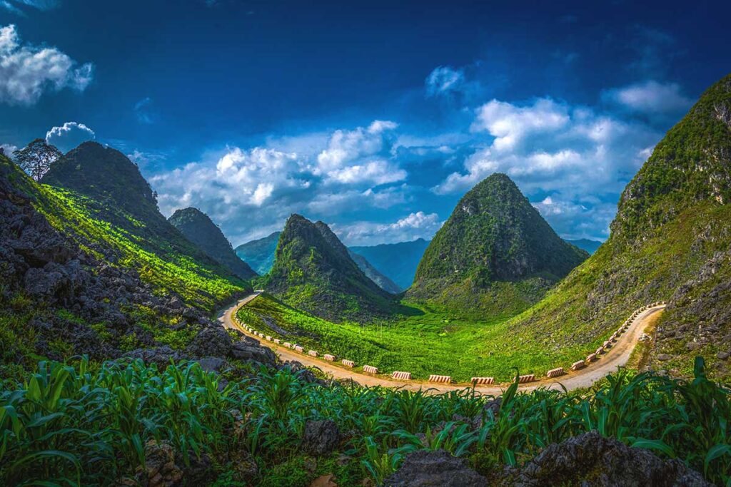 A road with mountain views of Ha Giang, part of Dong Van Karst Plateau Geopark