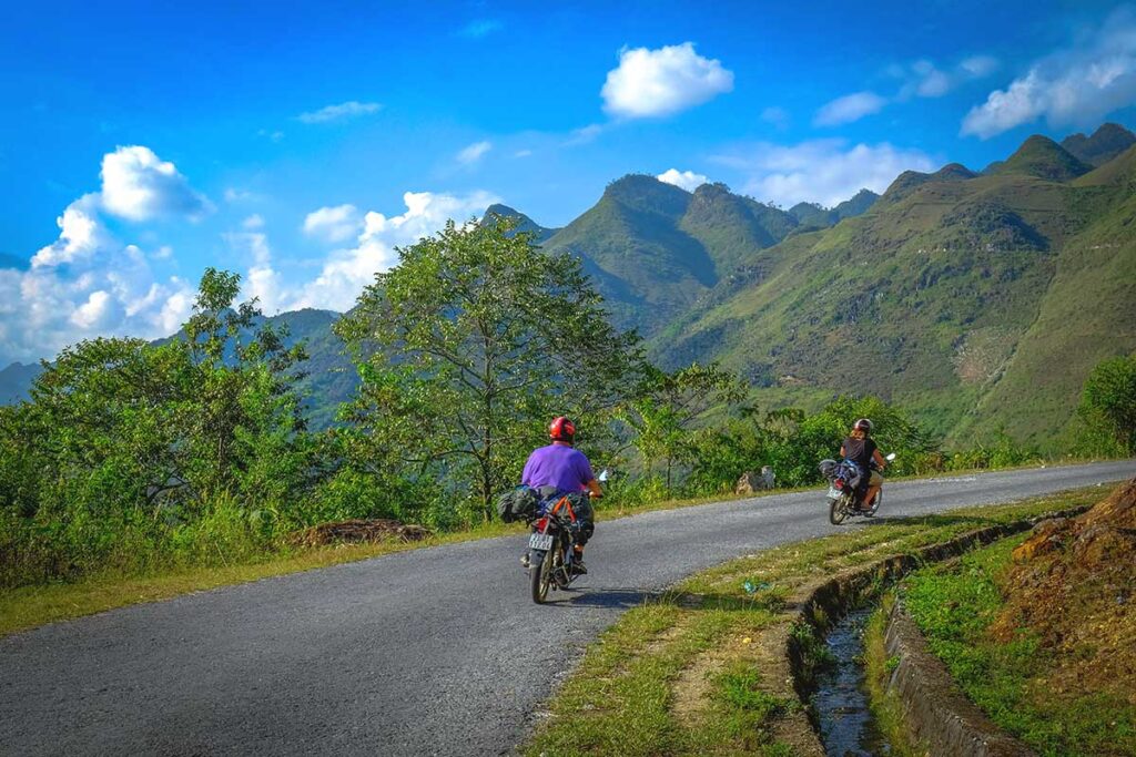 Two tourists driving motorbike on the Ha Giang loop