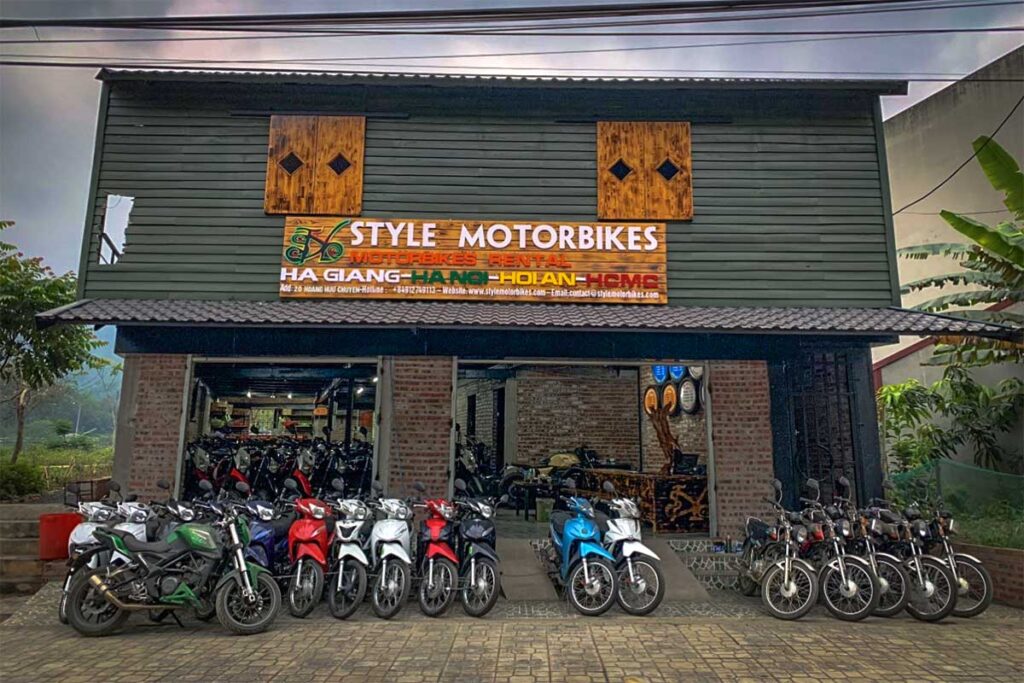 Motorbikes parked in front of a motorbike rental shop in Ha Giang