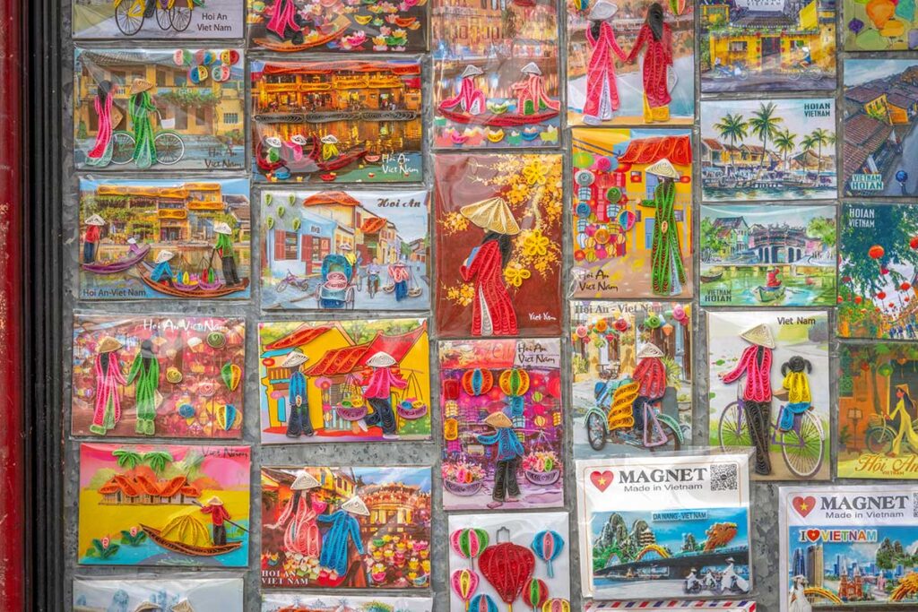 Handmade souvenir magnets with Hoi An designs, featuring lanterns, ao dai, and ancient town scenery.