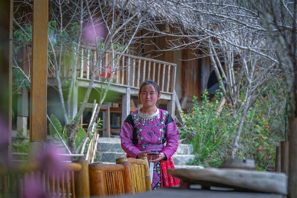 A White Tay woman in traditional clothes at her local homestay in Hang Kia Commune - Mai Chau