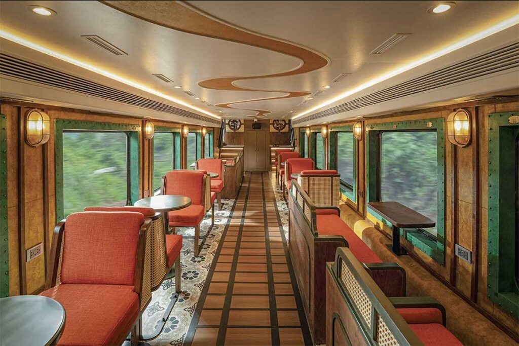 Interior of a Vietnam train carriage with soft seats and large windows, showing a clean and comfortable space for train travel in Vietnam