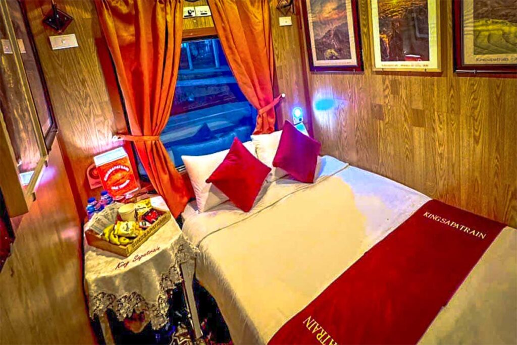 A double bed inside luxury cabin of King Express Hanoi to Sapa train