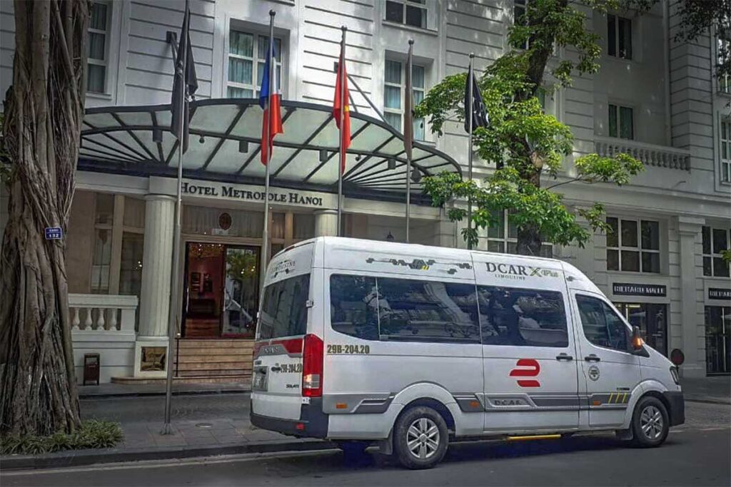 A limousine van parked outside a hotel in Hanoi before departing to Sapa