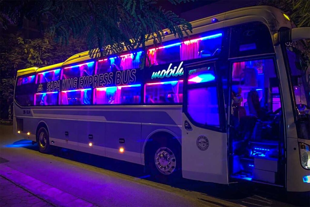A sleeper bus at night parked before heading from Hanoi to Sapa