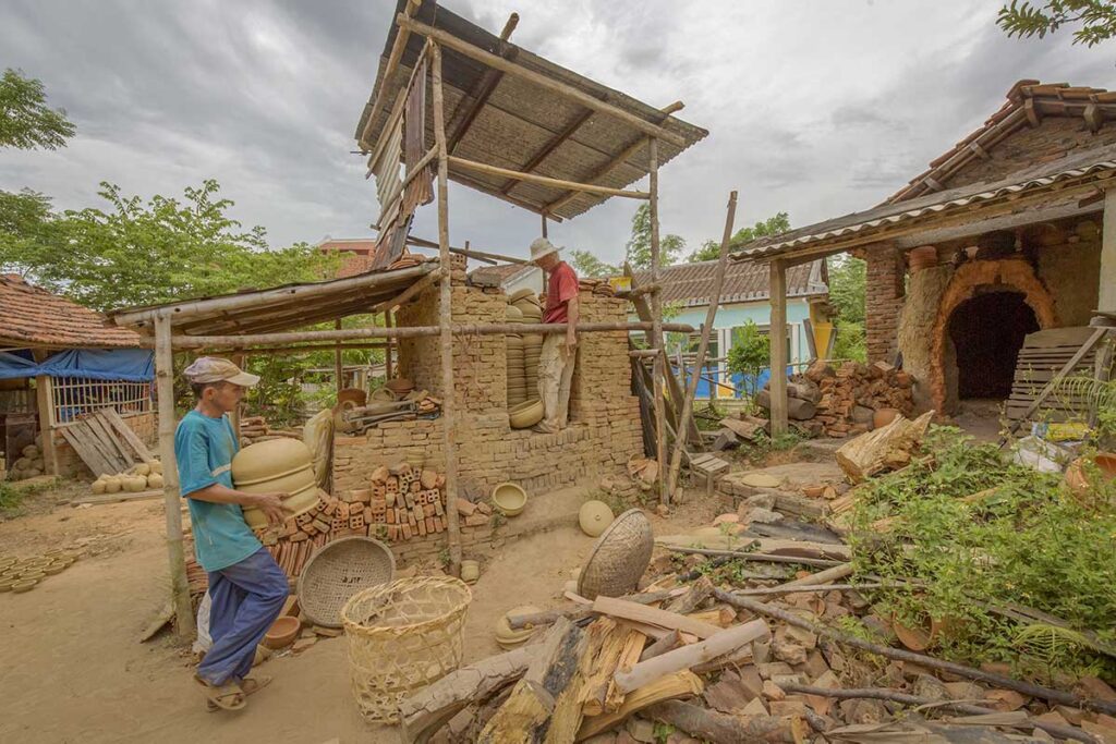 Artisans working at a clay kiln in Thanh Ha Pottery Village, one of the most historic craft villages around Hoi An.