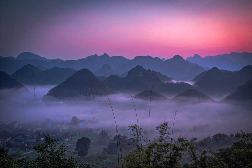 The Twin Mountains covered in mist with just the tops sticking out