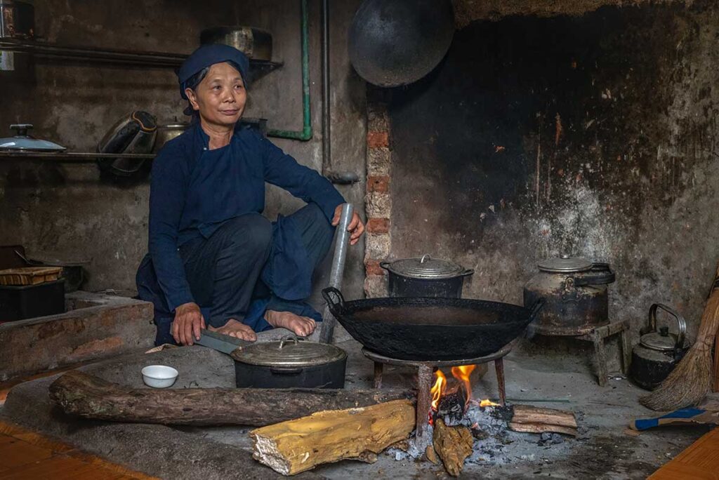 A local Tay ethnic woman sitting inside a traditional house in Ba Be