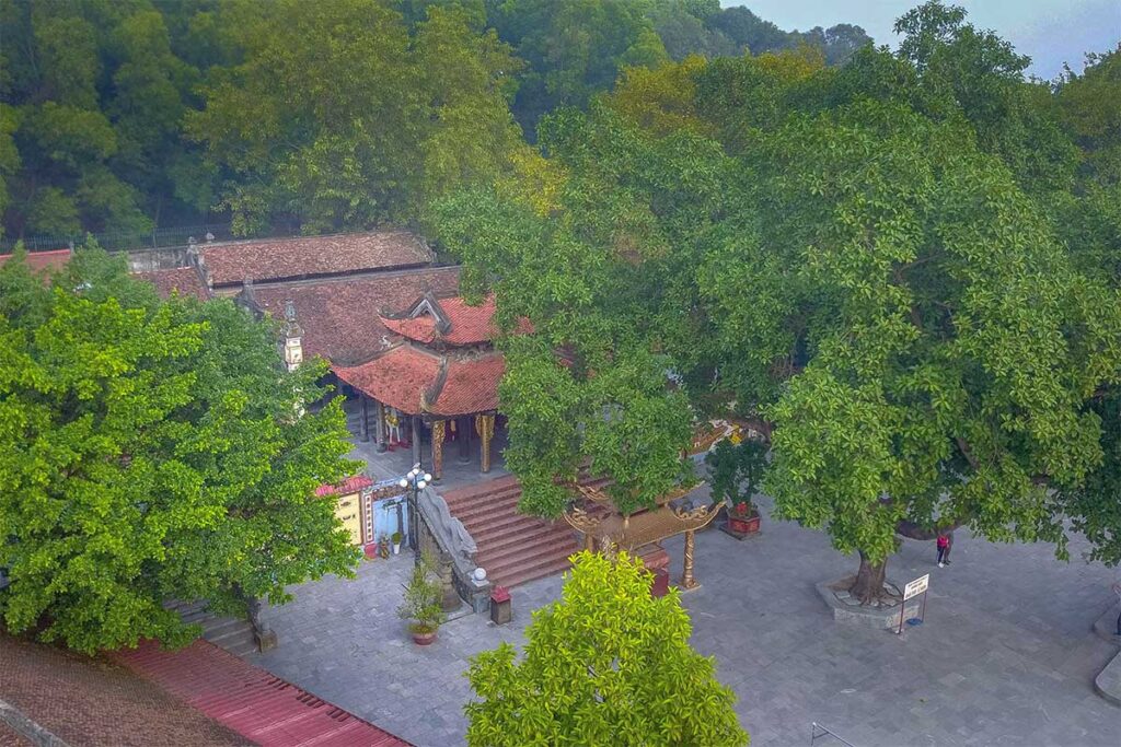 Aerial view of Ba Chua Kho Temple that is surrounded with trees