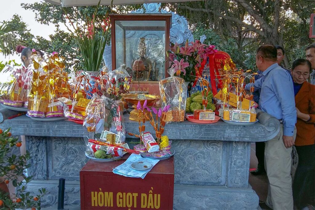 Joss Paper gifts set near an altar outside near Ba Chua Kho Temple