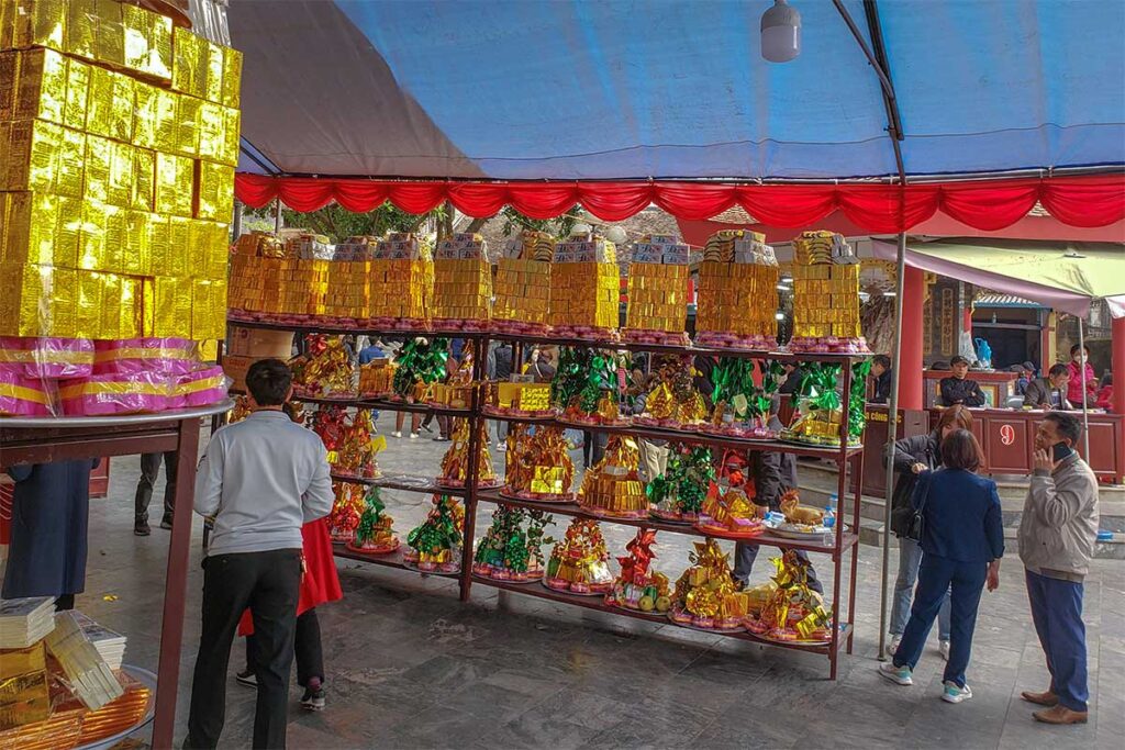 Stalls selling joss paper items near the entrance of Ba Chua Kho Temple