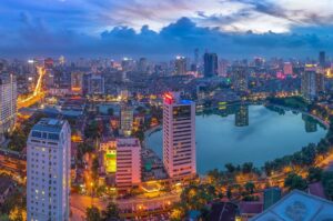 Hanoi city by twilight period, with Giang Vo lake, Ba Dinh district. Aerial skyline view