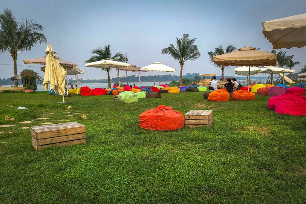 A coffee shop along the Red River in Hanoi with bean bags nearby  Rainbow Slide