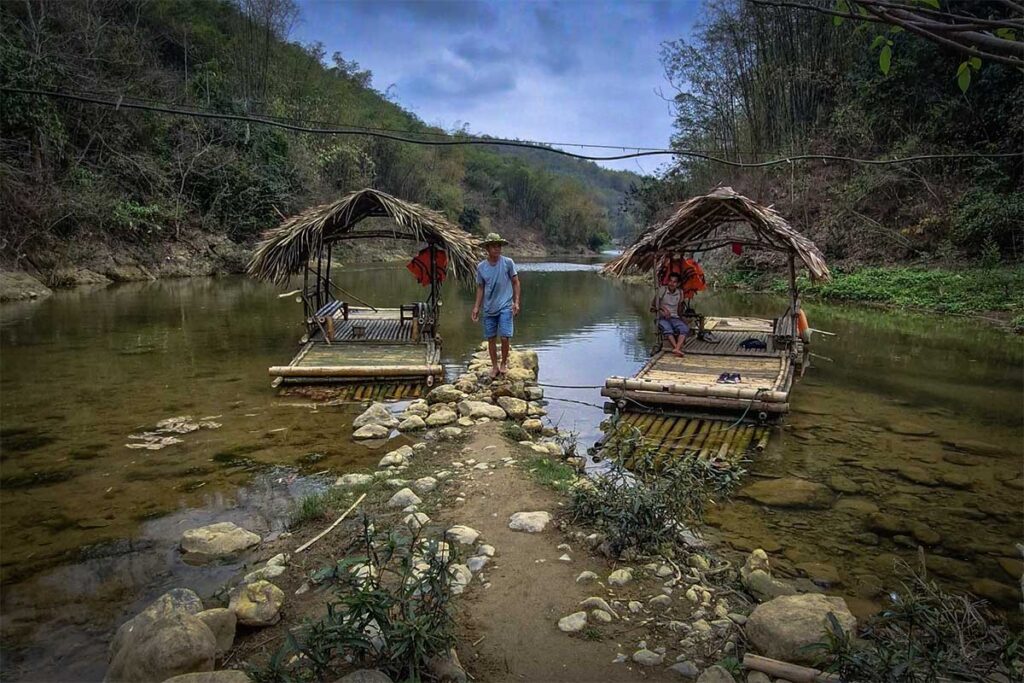 Bamboo rafts parked along a stream in Pu Luong