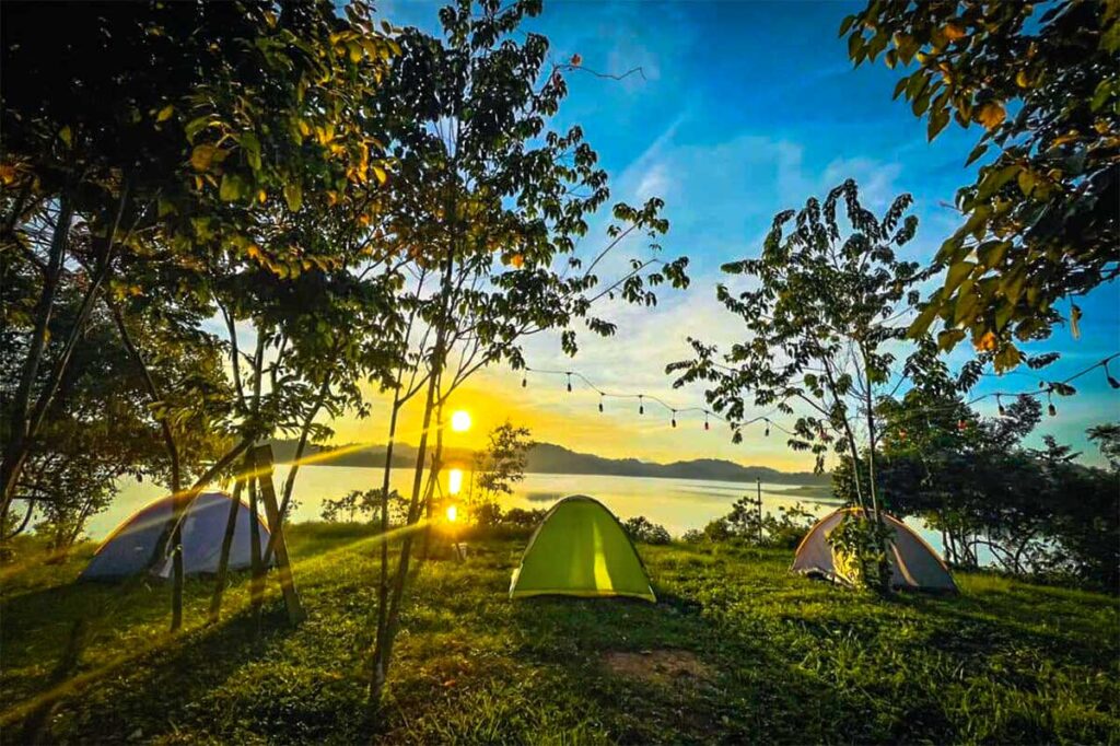 Sunset at Ben En National park with three tents set up near the lake