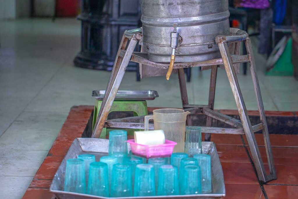 A barrel of Bia Hoi and typical Bia Hoi glasses at a bar in Bia Hoi Corner in Hanoi
