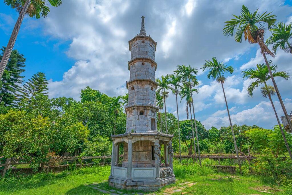 The Bao Nghiem Tower in a peaceful garden with palm trees part of But Thap Pagoda in Bac Ninh