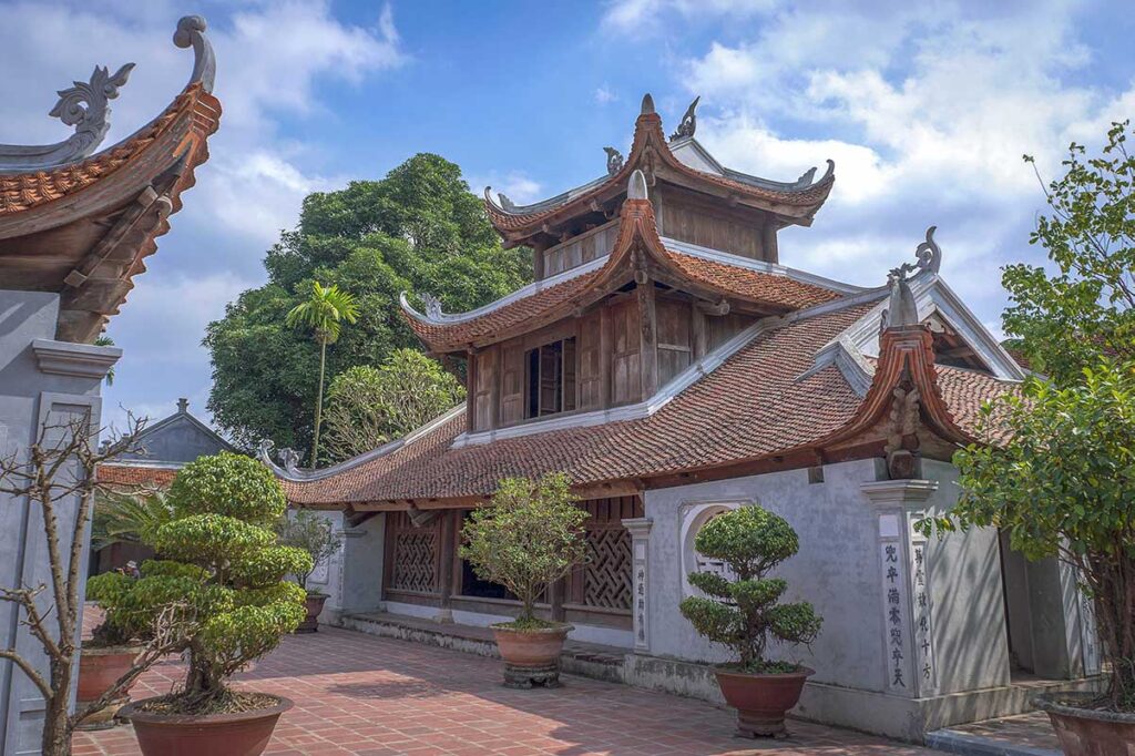 One of the main temple buildings with stone walls below and beautiful Chinese-style wooden roofs