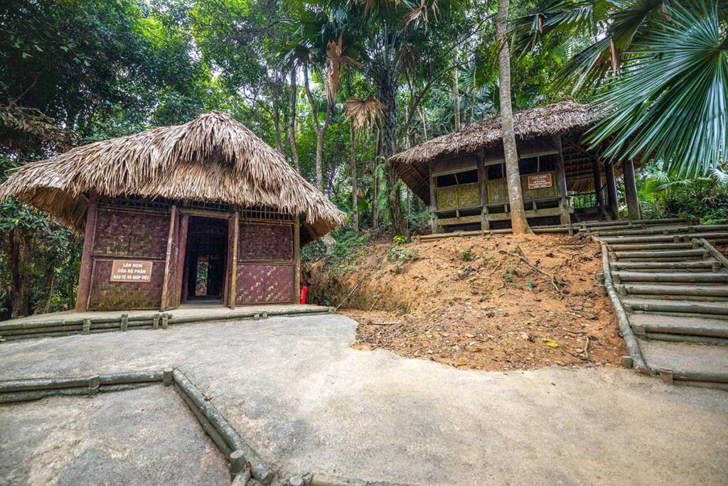 Simple bamboo huts hidden between jungle foliage part of ATK Dinh Hoa Safe Zone