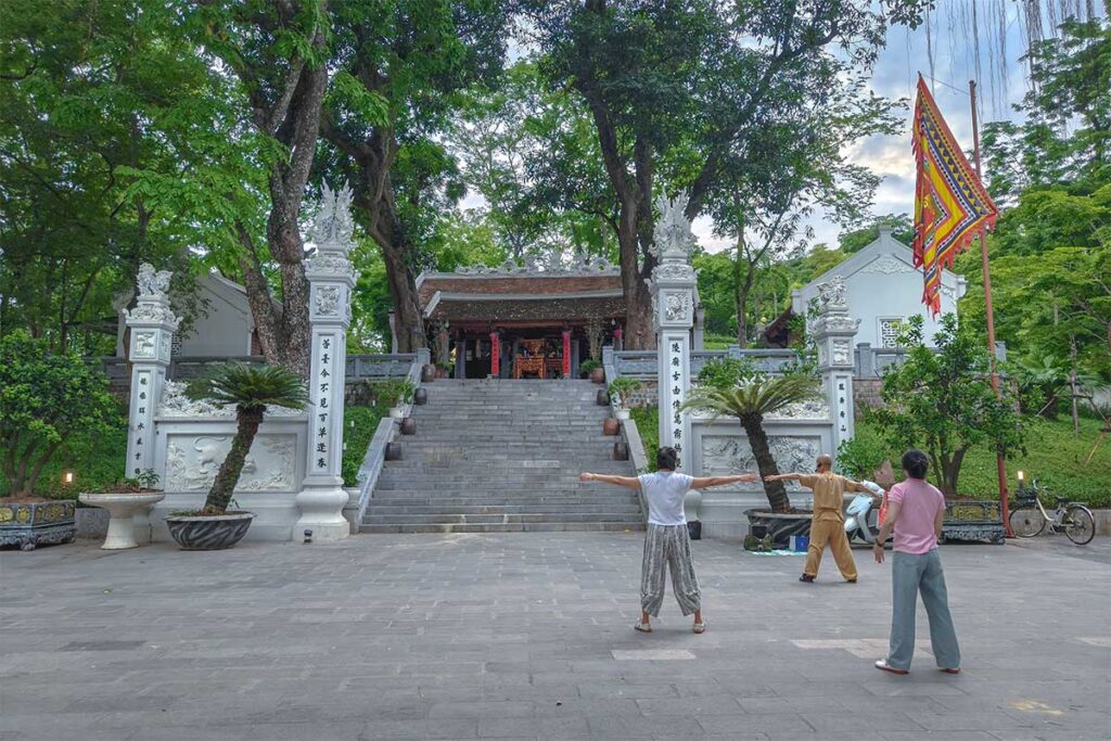 Locals doing Tai Chi or working out at Hanoi Botanical Gardens