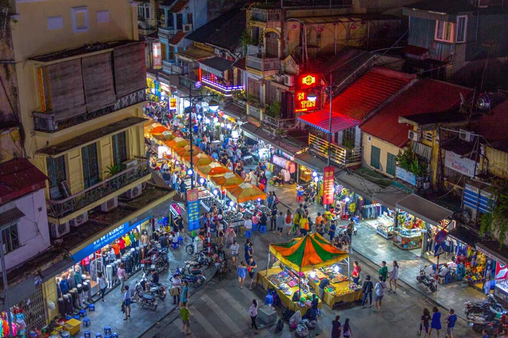 View from higher up over the Hanoi Weekend Night Market below with many people and stalls