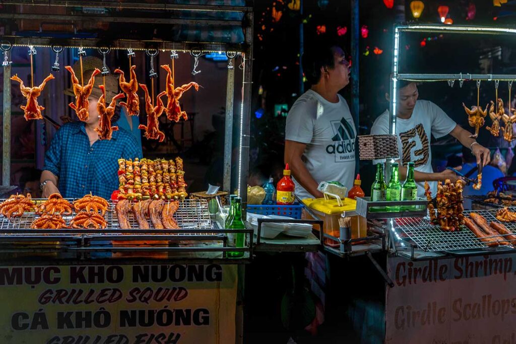 A street food stall selling grilled frogs on the Hanoi Weekend Night Market