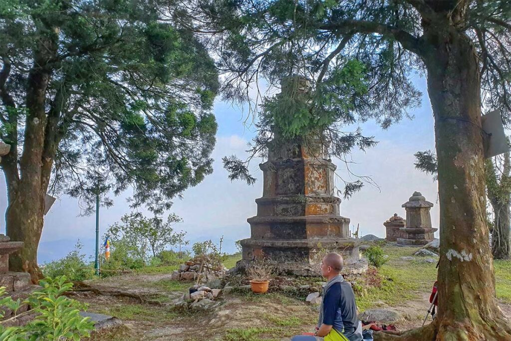 A man meditating at Hue Quang Stupa