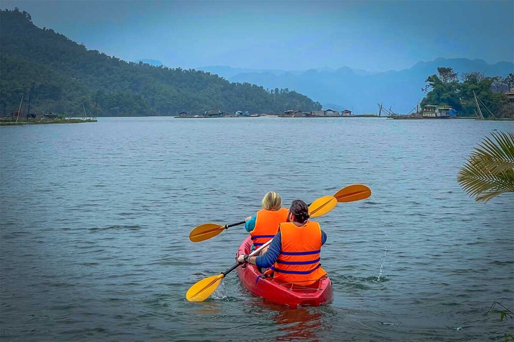 Two people in a kayak on Hoa Binh Lake