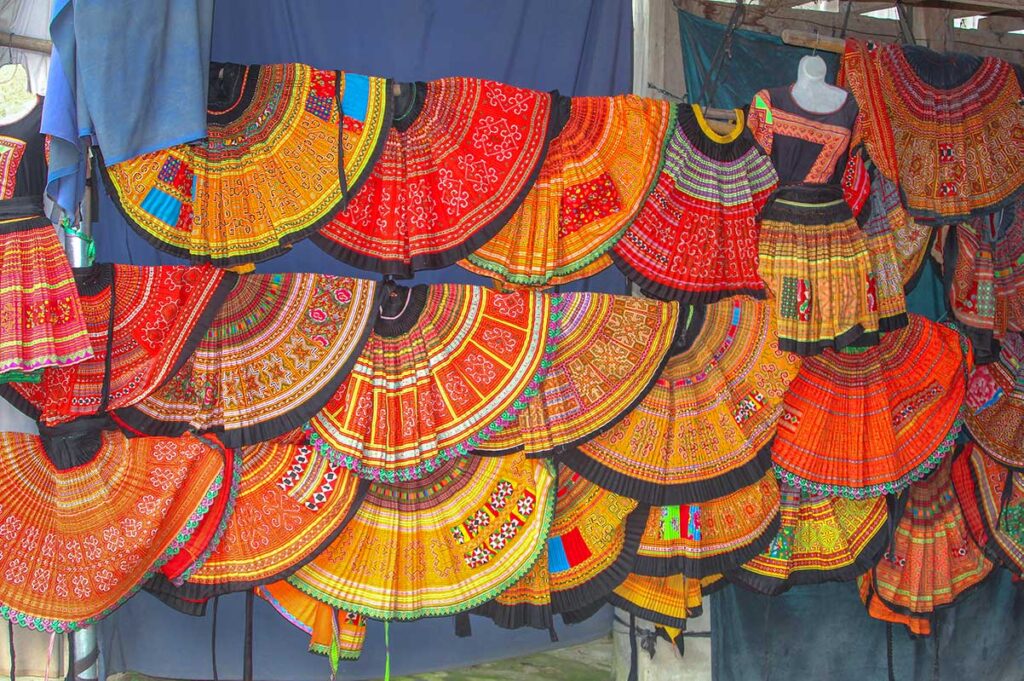 Traditional clothes are hanging at a local house for sale in Lac Village