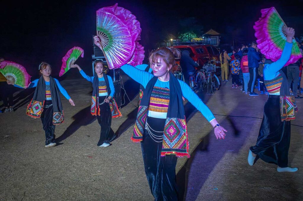 A traditional dance performance done by White Tay ethnic woman at night