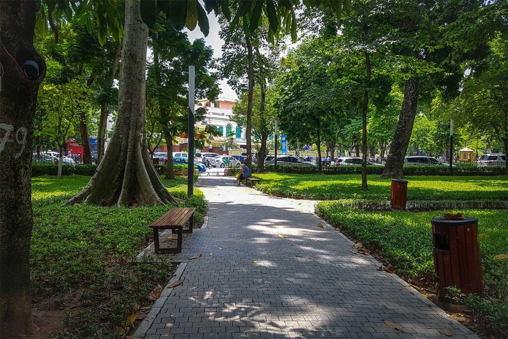 A few benches in the shade and under the trees of Lenin Park in Hanoi